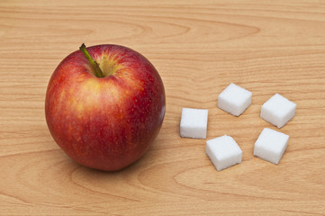 Würfelzucker und Apfel