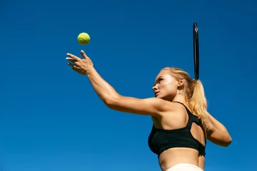 Rolgordijnen Sports Woman Playing Tennis Outdoors © puhhha