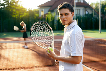 Sports Man Before Playing Tennis On Court.