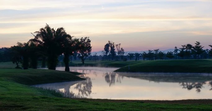 Golf course with foggy in the morning.