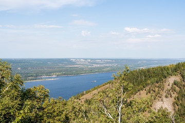 View of Volga riverbed, coastline and small town from top of the Zhiguli mountains