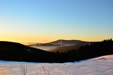 Beautiful sunset in winter over the mountains