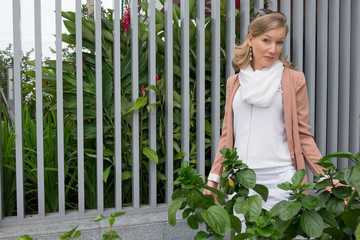 Serious Beautiful Women Near Plants Outdoors