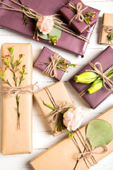 Flowers composition. Flowers and gifts on white background. Flat lay, top view.