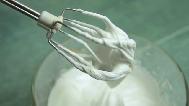 cooking glaze or royal icing close-up on the table background
