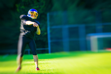 American Football Player Throwing The Ball