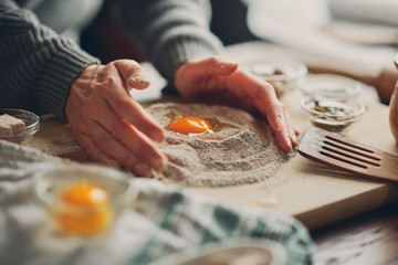 Close up of woman`s hands making a bread.