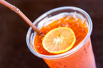 a glass of ice lemon tea in coffee shop vintage style Thailand