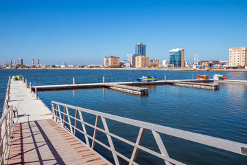 Naklejka premium Ras Al Khaimah during sunny day . View to beautiful bay with harbour in background