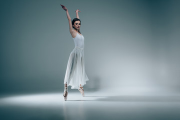 female ballet dancer in white dress