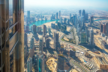 Fototapeta na wymiar Skyscrapers on Sheikh Zayed Road in Dubai, UAE. View of Downtown Dubai from the observation desk of Burj Khalifa.