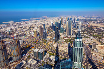 Naklejka na ściany i meble Skyscrapers on Sheikh Zayed Road in Dubai, UAE. View of Downtown Dubai from the observation desk of Burj Khalifa.