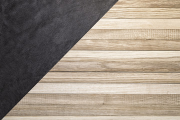 Backdrop of wooden oak boards and dark brown leather