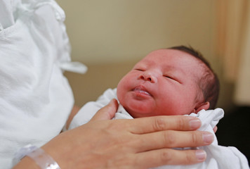 Mother is belching for infant baby.