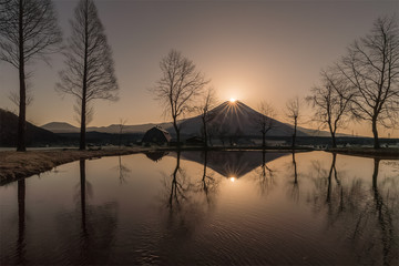 Diamonf Fuji seen from Fumotopara camping ground, Fujinomiya , Shizuoka prefecture. Diamond Fuji is View of the setting sun meeting the summit of Mt. Fuji