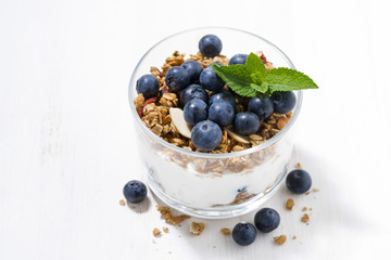 dessert with fresh blueberries, granola and cream, top view