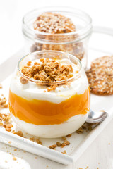dessert with pumpkin, whipped cream and cookies, vertical closeup