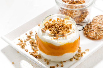 dessert with pumpkin, cream and biscuits, top view