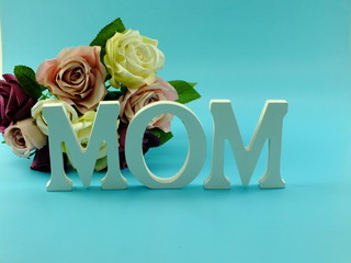 word text mom and flower bouquet with space background mothers day concept