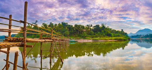 Beautiful view of a bamboo bridge. Laos landscape. Panorama