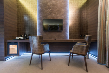 Two armchairs and vanity table in home interior