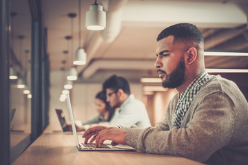 Young specialists in coworking office