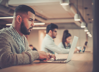 Young specialists in coworking office