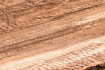 Traces from the car on the red clay soil