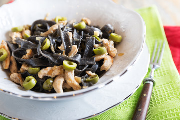 Black ink pasta with chicken and green olives