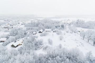 Aerial: Snow-covered countryside in winter