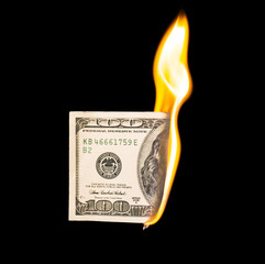 a hundred dollars burn in a fire on a black background
