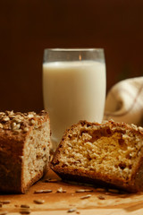 Homemade fresh baked bread with jam and glass of milk