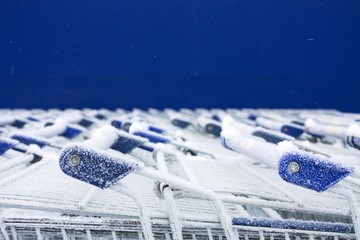 parking for shopping trolley in the snow. Frozen market 1