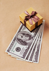 Four hundred dollars and golden gift box