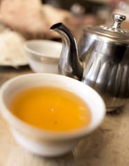 Hot tea in a pial in a cafe