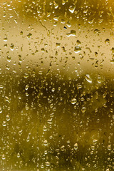 drops of rain on the window as a background