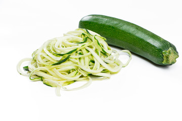 Raw ucchini noodles in a stack isolated