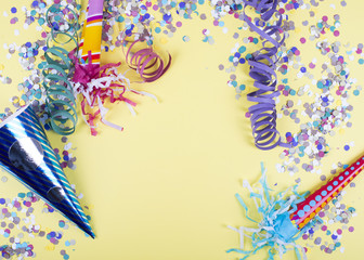 Background of yellow color, decorated celebration with confetti and balloons. Copyspace