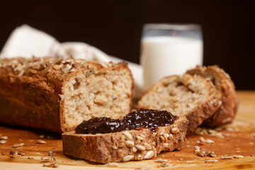 Fototapeta na wymiar Homemade fresh baked bread with jam and glass of milk