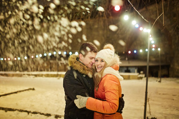 boy and girl playing with snow