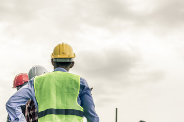 Engineer pointing orders for worker team to work safety