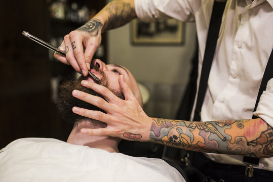 modern hairdressing. Beards, tattoos and hair art.