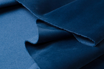 Bright blue velour textile sample. Fabric texture background