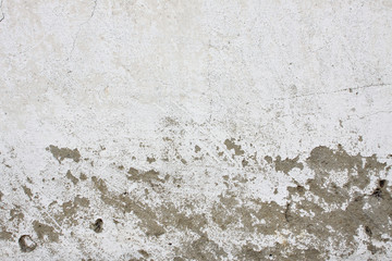 old plaster wall with cracked plaster