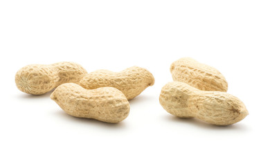 Unshelled peanuts five raw isolated on white background.