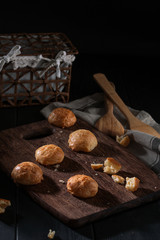 Small snack cheese bread with black wooden