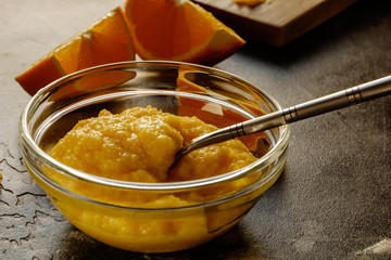 Fresh smoothie with oranges and two slices of orange. Prepared food.