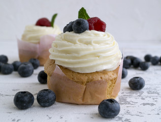 Homemade cake with sweet cream and berries.