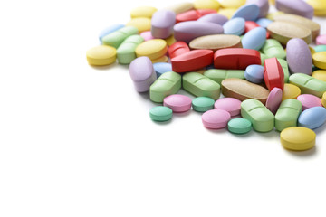 Obraz na płótnie Canvas Pharmacy theme. Multicolored Isolated Pills and Capsules