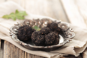Fototapeta na wymiar Black truffles on plate.